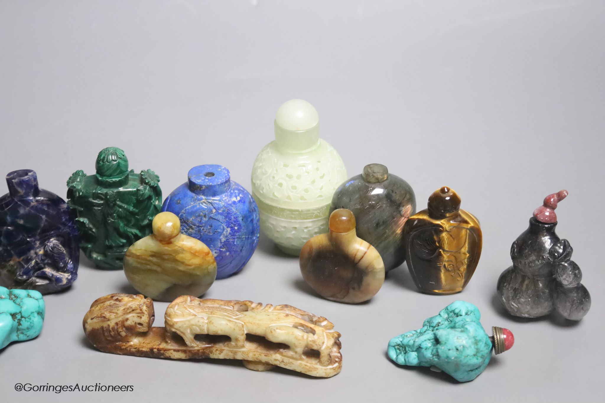 Thirteen mixed Chinese lapis lazuli, turquoise and other carved snuff bottles